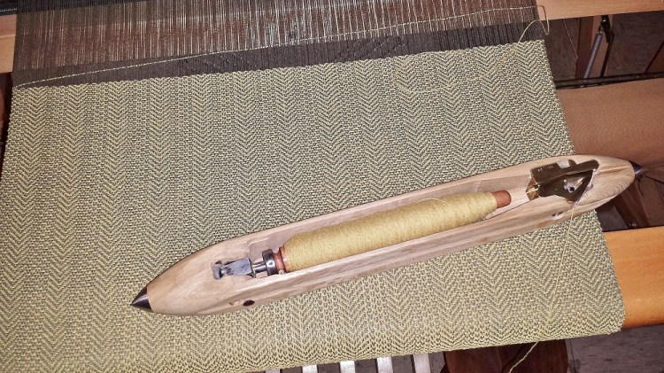 fly shuttle on gold herringbone detail